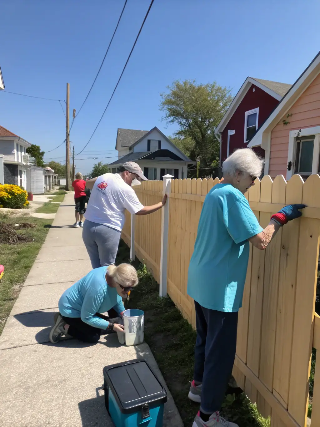 A heartwarming image of volunteers from LE CRI DU PAPIER assisting elderly residents during a community outreach program, showcasing the organization's commitment to social support and improving the quality of life for vulnerable populations.